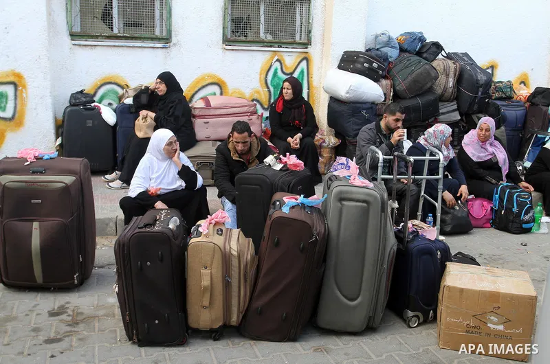 Palestinians wait at the Rafah border crossing with Egypt, in the southern Gaza Strip, after it was opened for two days by Egyptian authorities, on May 11, 2016. On May 2 Israeli Defence Minister Moshe Yaalon on Monday a...