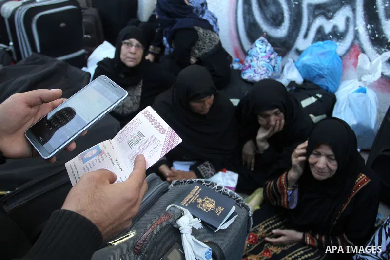 Palestinians wait at the Rafah border crossing with Egypt, in the southern Gaza Strip, after it was opened for two days by Egyptian authorities on May 12, 2016. Israeli Defence Minister Moshe Yaalon announced on May 2, 2...