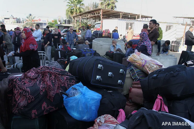 Palestinians wait at the Rafah border crossing with Egypt, in the southern Gaza Strip, after it was opened for two days by Egyptian authorities on May 12, 2016. Israeli Defence Minister Moshe Yaalon announced on May 2, 2...