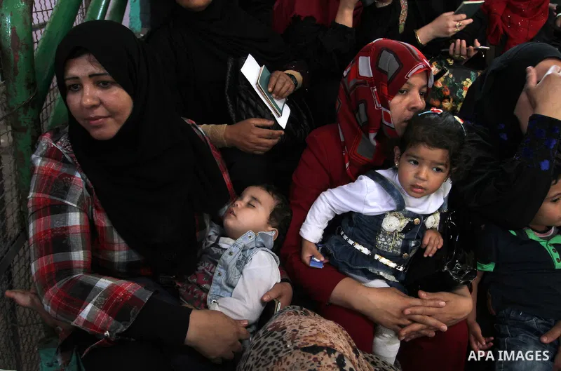 Palestinians wait at the Rafah border crossing with Egypt, in the southern Gaza Strip, after it was opened for two days by Egyptian authorities on May 12, 2016. Israeli Defence Minister Moshe Yaalon announced on May 2, 2...