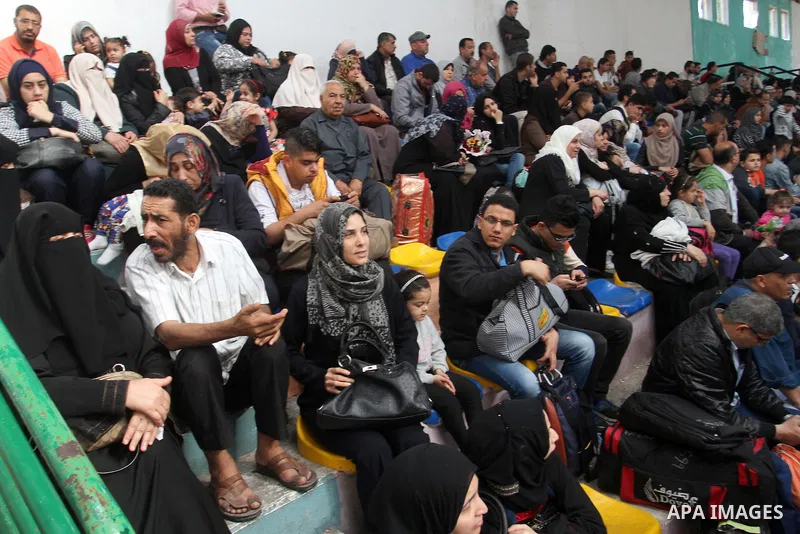 Palestinians wait at the Rafah border crossing with Egypt, in the southern Gaza Strip, after it was opened for two days by Egyptian authorities on May 12, 2016. Israeli Defence Minister Moshe Yaalon announced on May 2, 2...