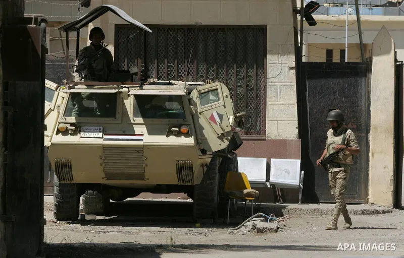 Egyptian soldiers stand guard on the Rafah border crossing at the southern Gaza Strip on May 12, 2016. Israeli Defence Minister Moshe Yaalon announced on May 2, 2016 the reopening of the Erez crossing point into the Pale...