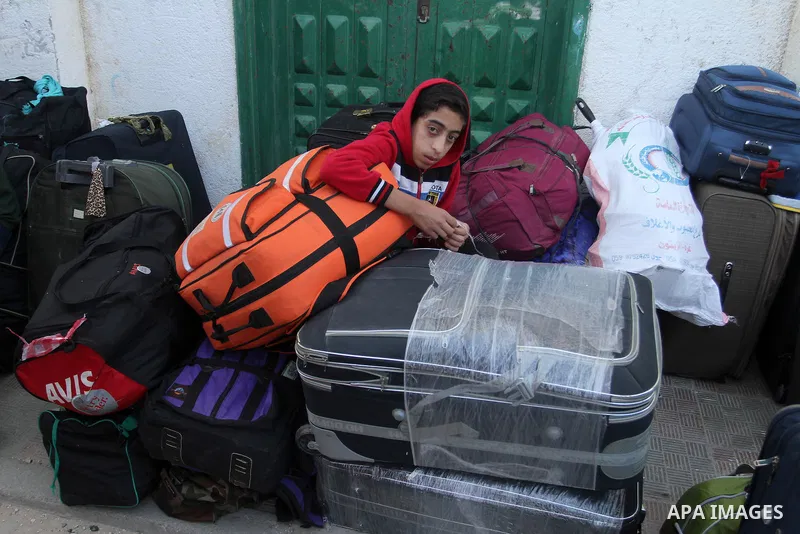 Palestinians wait at the Rafah border crossing with Egypt, in the southern Gaza Strip, after it was opened for two days by Egyptian authorities on May 12, 2016. Israeli Defence Minister Moshe Yaalon announced on May 2, 2...