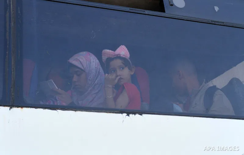 Palestinians wait at the Rafah border crossing with Egypt, in the southern Gaza Strip, after it was opened for two days by Egyptian authorities on May 12, 2016. Israeli Defence Minister Moshe Yaalon announced on May 2, 2...