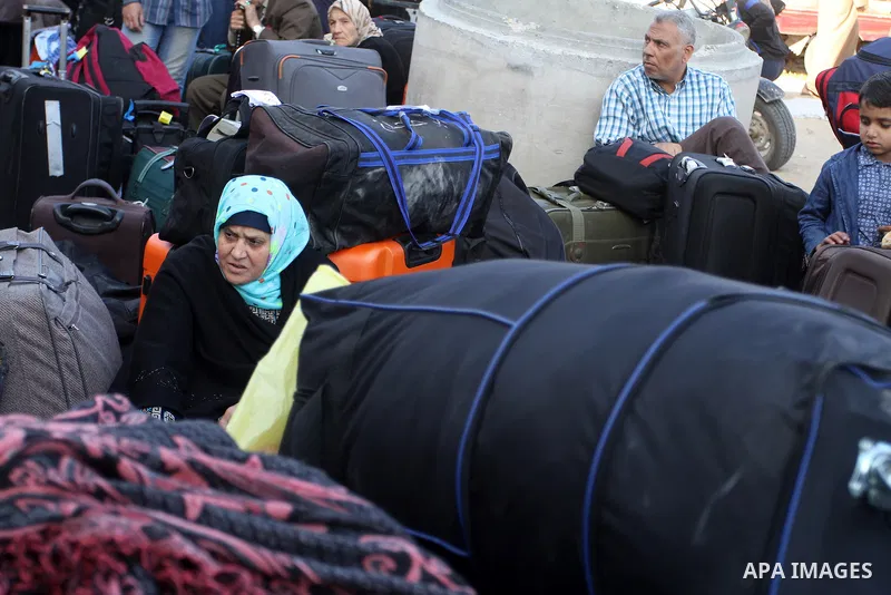 Palestinians wait at the Rafah border crossing with Egypt, in the southern Gaza Strip, after it was opened for two days by Egyptian authorities on May 12, 2016. Israeli Defence Minister Moshe Yaalon announced on May 2, 2...