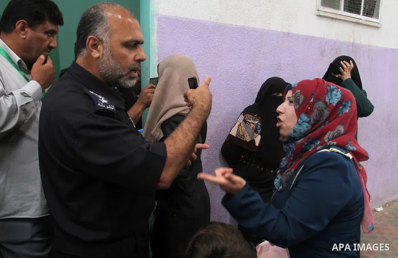Palestinians wait at the Rafah border crossing with Egypt, in the southern Gaza Strip, after it was opened for two days by Egyptian authorities on May 12, 2016. Israeli Defence Minister Moshe Yaalon announced on May 2, 2...