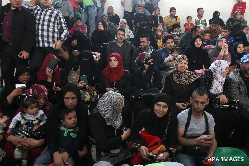 Palestinians wait at the Rafah border crossing with Egypt, in the southern Gaza Strip, after it was opened for two days by Egyptian authorities on May 12, 2016. Israeli Defence Minister Moshe Yaalon announced on May 2, 2...
