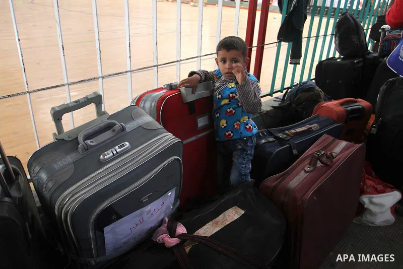 Palestinians wait at the Rafah border crossing with Egypt, in the southern Gaza Strip, after it was opened for two days by Egyptian authorities on May 12, 2016. Israeli Defence Minister Moshe Yaalon announced on May 2, 2...
