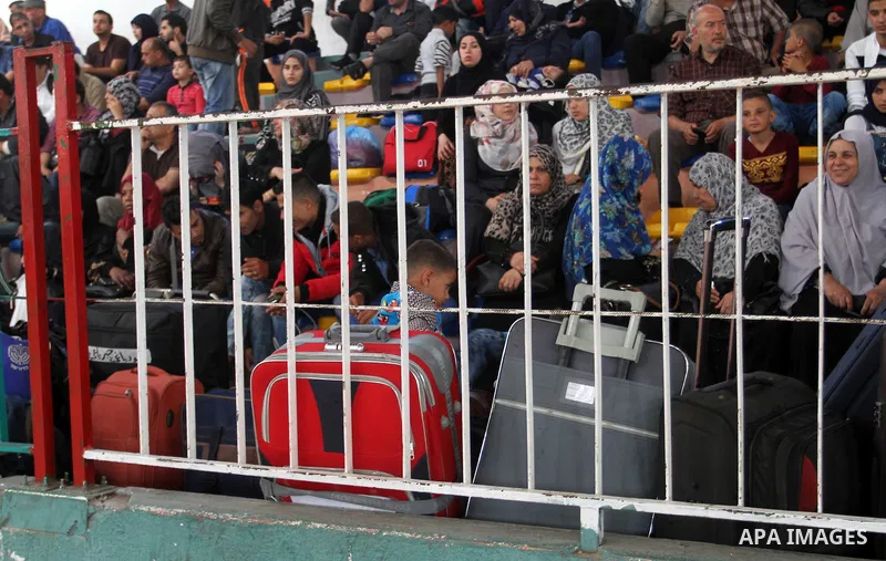 Palestinians wait at the Rafah border crossing with Egypt, in the southern Gaza Strip, after it was opened for two days by Egyptian authorities on May 12, 2016. Israeli Defence Minister Moshe Yaalon announced on May 2, 2...