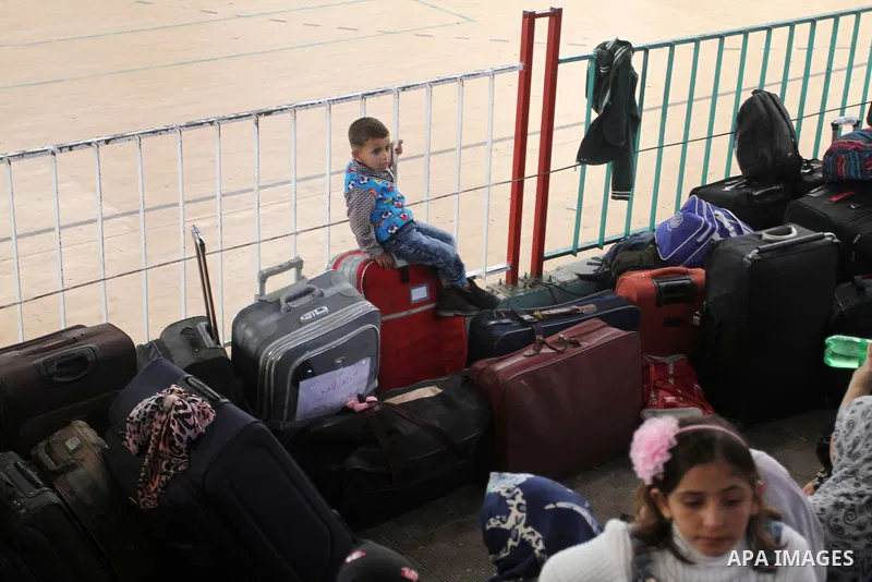 Palestinians wait at the Rafah border crossing with Egypt, in the southern Gaza Strip, after it was opened for two days by Egyptian authorities on May 12, 2016. Israeli Defence Minister Moshe Yaalon announced on May 2, 2...