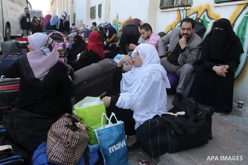 Palestinians wait at the Rafah border crossing with Egypt, in the southern Gaza Strip, after it was opened for two days by Egyptian authorities on May 12, 2016. Israeli Defence Minister Moshe Yaalon announced on May 2, 2...