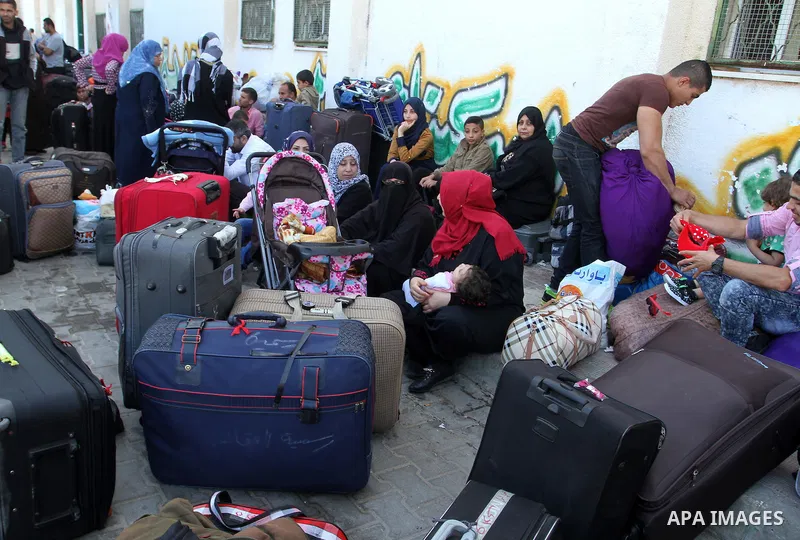Palestinians wait at the Rafah border crossing with Egypt, in the southern Gaza Strip, after it was opened for two days by Egyptian authorities on May 12, 2016. Israeli Defence Minister Moshe Yaalon announced on May 2, 2...