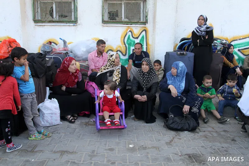 Palestinians wait at the Rafah border crossing with Egypt, in the southern Gaza Strip, after it was opened for two days by Egyptian authorities on May 12, 2016. Israeli Defence Minister Moshe Yaalon announced on May 2, 2...