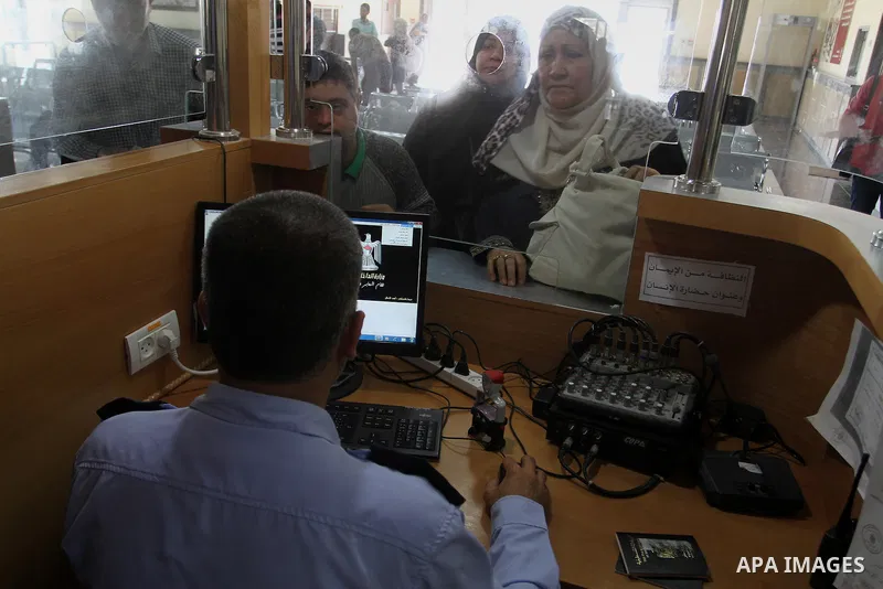 Palestinians wait at the Rafah border crossing with Egypt, in the southern Gaza Strip, after it was opened for two days by Egyptian authorities on May 12, 2016. Israeli Defence Minister Moshe Yaalon announced on May 2, 2...