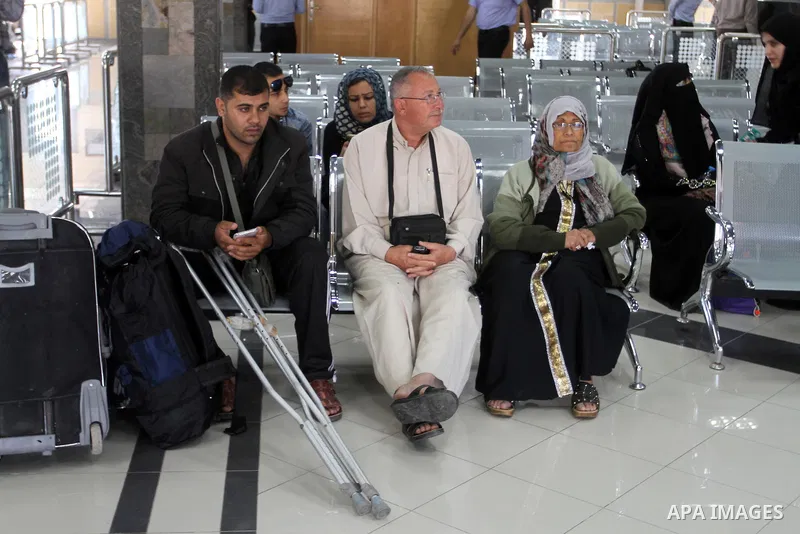 Palestinians wait at the Rafah border crossing with Egypt, in the southern Gaza Strip, after it was opened for two days by Egyptian authorities on May 12, 2016. Israeli Defence Minister Moshe Yaalon announced on May 2, 2...