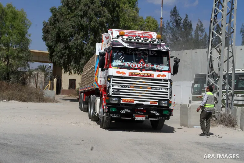 A truck loded with cement enters from Egypt through the Rafah border crossing in southern Gaza Strip on May 12, 2016. Israeli Defence Minister Moshe Yaalon announced on May 2, 2016 the reopening of the Erez crossing poin...