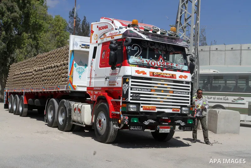 A truck loded with cement enters from Egypt through the Rafah border crossing in southern Gaza Strip on May 12, 2016. Israeli Defence Minister Moshe Yaalon announced on May 2, 2016 the reopening of the Erez crossing poin...