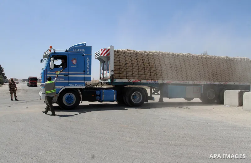 A truck loded with cement enters from Egypt through the Rafah border crossing in southern Gaza Strip on May 12, 2016. Israeli Defence Minister Moshe Yaalon announced on May 2, 2016 the reopening of the Erez crossing poin...