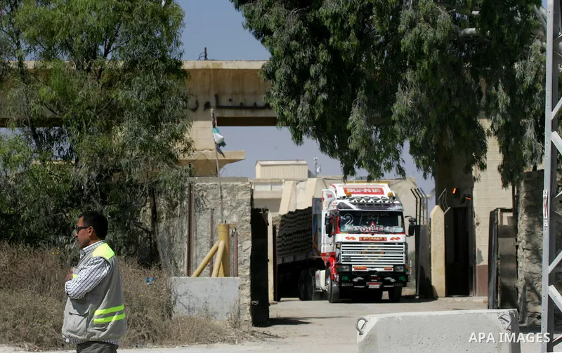 A truck loded with cement enters from Egypt through the Rafah border crossing in southern Gaza Strip on May 12, 2016. Israeli Defence Minister Moshe Yaalon announced on May 2, 2016 the reopening of the Erez crossing poin...