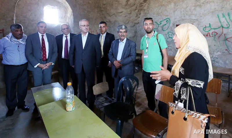 Palestinian Prime Minister Rami Hamdallah visits Palestinians in Khirbet Tana, near the West Bank of Nablus, on May 12, 2016. Photo by Prime Minister Office