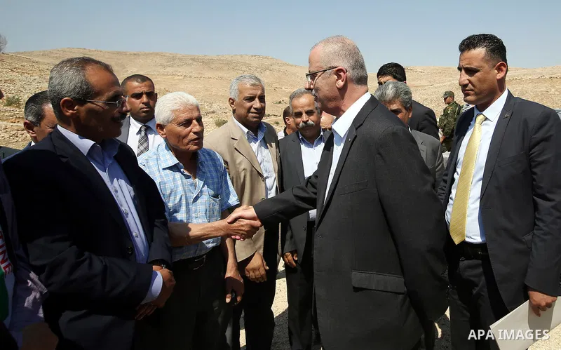 Palestinian Prime Minister Rami Hamdallah visits Palestinians in Khirbet Tana, near the West Bank of Nablus, on May 12, 2016. Photo by Prime Minister Office