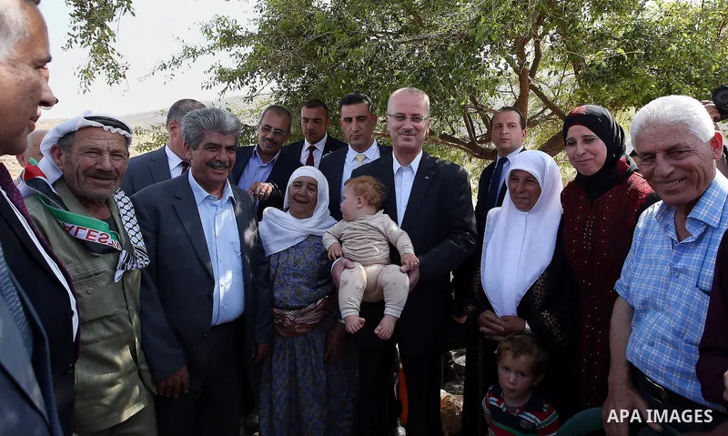 Palestinian Prime Minister Rami Hamdallah visits Palestinians in Khirbet Tana, near the West Bank of Nablus, on May 12, 2016. Photo by Prime Minister Office