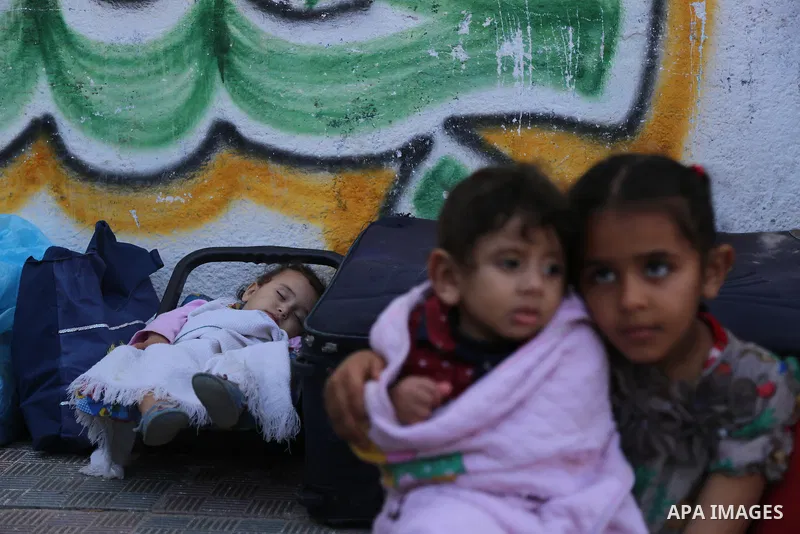 Palestinians wait at the Rafah border crossing with Egypt, in the southern Gaza Strip, after it was opened for two days by Egyptian authorities on May 12, 2016. Israeli Defence Minister Moshe Yaalon announced on May 2, 2...