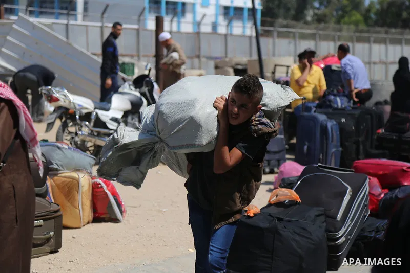 Palestinians wait at the Rafah border crossing with Egypt, in the southern Gaza Strip, after it was opened for two days by Egyptian authorities on May 12, 2016. Israeli Defence Minister Moshe Yaalon announced on May 2, 2...