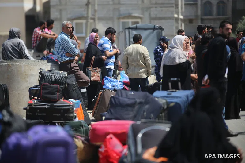 Palestinians wait at the Rafah border crossing with Egypt, in the southern Gaza Strip, after it was opened for two days by Egyptian authorities on May 12, 2016. Israeli Defence Minister Moshe Yaalon announced on May 2, 2...