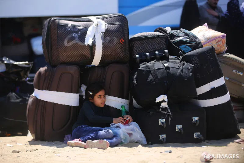 Palestinians wait at the Rafah border crossing with Egypt, in the southern Gaza Strip, after it was opened for two days by Egyptian authorities on May 12, 2016. Israeli Defence Minister Moshe Yaalon announced on May 2, 2...