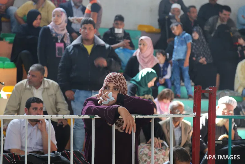 Palestinians wait at the Rafah border crossing with Egypt, in the southern Gaza Strip, after it was opened for two days by Egyptian authorities on May 12, 2016. Israeli Defence Minister Moshe Yaalon announced on May 2, 2...