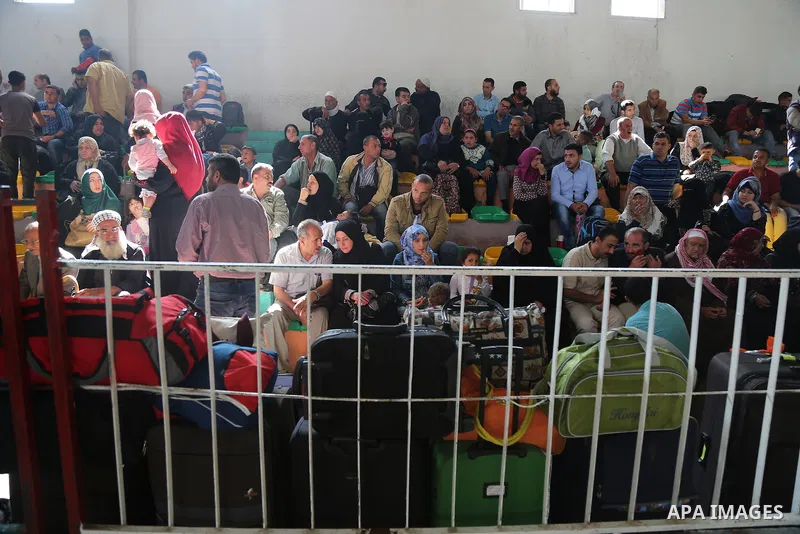 Palestinians wait at the Rafah border crossing with Egypt, in the southern Gaza Strip, after it was opened for two days by Egyptian authorities on May 12, 2016. Israeli Defence Minister Moshe Yaalon announced on May 2, 2...
