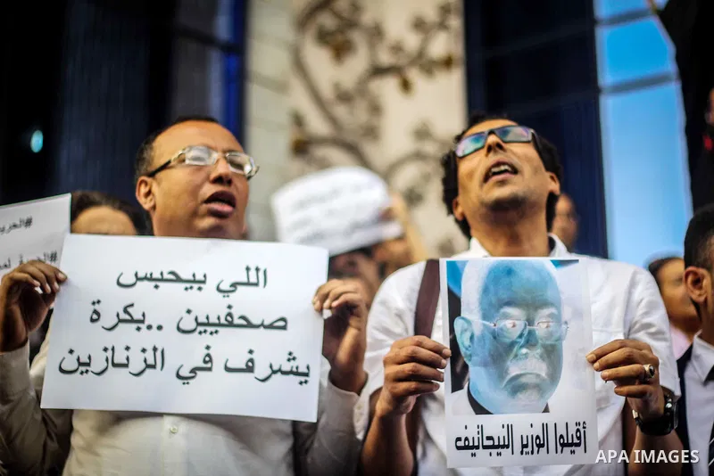 Egyptian Journalists and activists chant slogans and hold banners during a protest in front of the Journalists' Syndicate in Cairo, Egypt, on May 12, 2016. Egypt's journalists' syndicate called for the dismissal of the i...