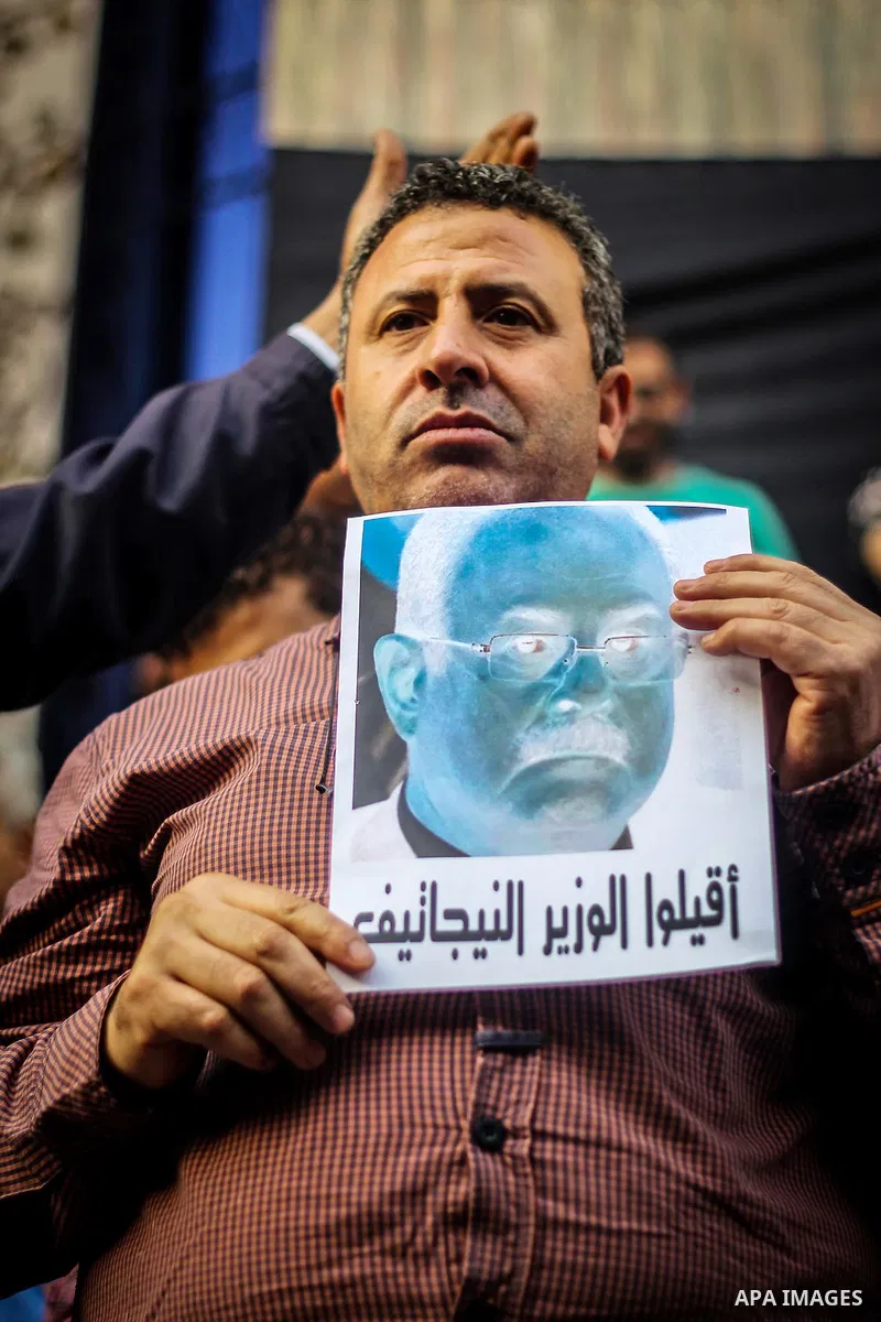 Egyptian Journalists and activists chant slogans and hold banners during a protest in front of the Journalists' Syndicate in Cairo, Egypt, on May 12, 2016. Egypt's journalists' syndicate called for the dismissal of the i...