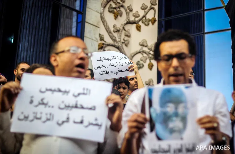 Egyptian Journalists and activists chant slogans and hold banners during a protest in front of the Journalists' Syndicate in Cairo, Egypt, on May 12, 2016. Egypt's journalists' syndicate called for the dismissal of the i...