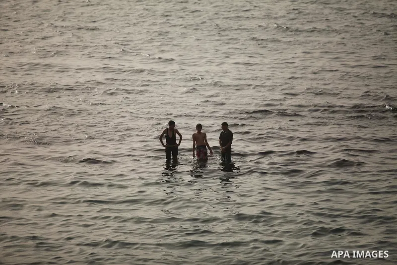 Palestinian children play in the water on the beach at the al-Shati refugee camp in Gaza City on May 14, 2016. Photo by Ashraf Amra