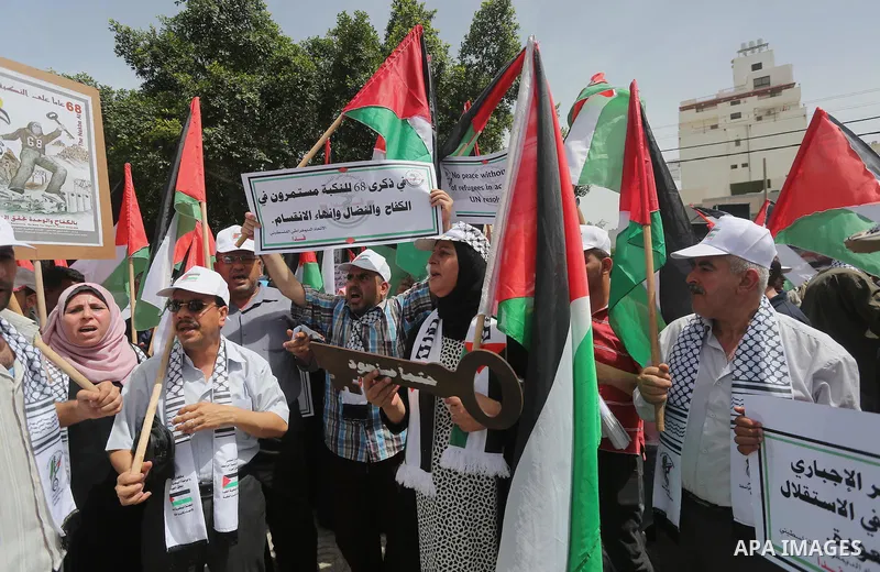 Palestinians wave national flags on May 15, 2016 in Gaza city during a rally to commemorate the "Nakba" or "catastrophe" in Arabic in reference to the establishment in 1948 of the state of Israel. "Nakba" means in Arabic...