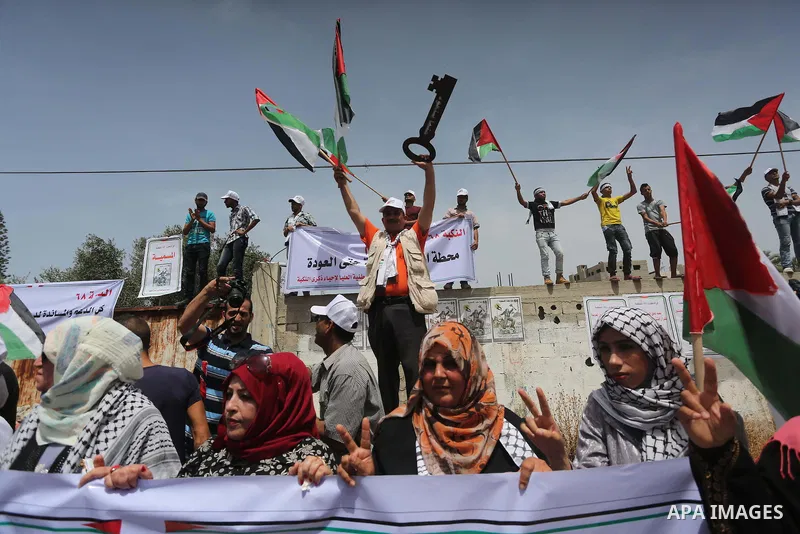Palestinians wave national flags on May 15, 2016 in Gaza city during a rally to commemorate the "Nakba" or "catastrophe" in Arabic in reference to the establishment in 1948 of the state of Israel. "Nakba" means in Arabic...