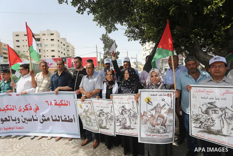 Palestinians wave national flags on May 15, 2016 in Gaza city during a rally to commemorate the "Nakba" or "catastrophe" in Arabic in reference to the establishment in 1948 of the state of Israel. "Nakba" means in Arabic...
