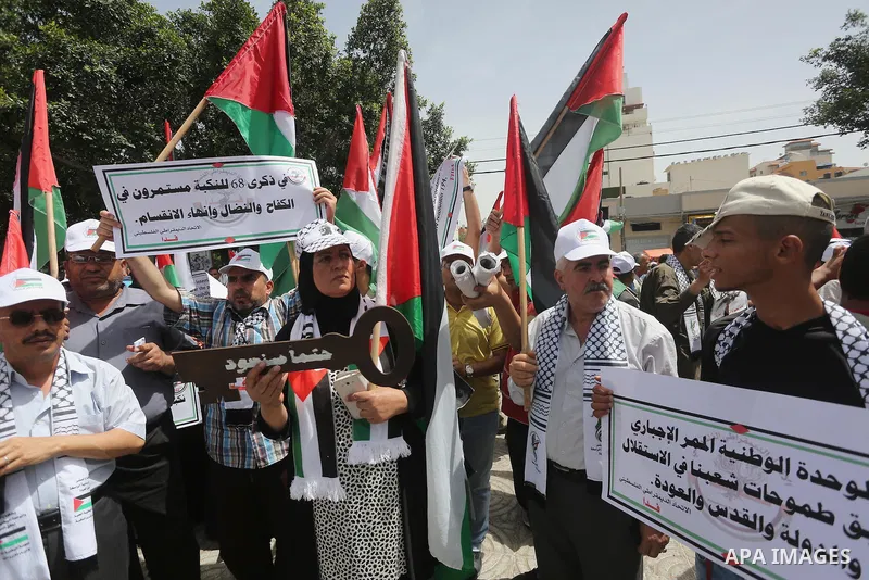 Palestinians wave national flags on May 15, 2016 in Gaza city during a rally to commemorate the "Nakba" or "catastrophe" in Arabic in reference to the establishment in 1948 of the state of Israel. "Nakba" means in Arabic...