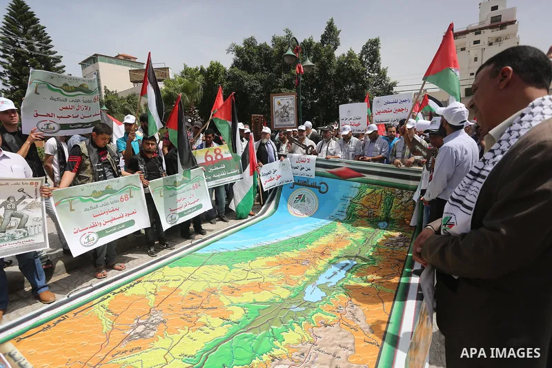 Palestinians wave national flags on May 15, 2016 in Gaza city during a rally to commemorate the "Nakba" or "catastrophe" in Arabic in reference to the establishment in 1948 of the state of Israel. "Nakba" means in Arabic...