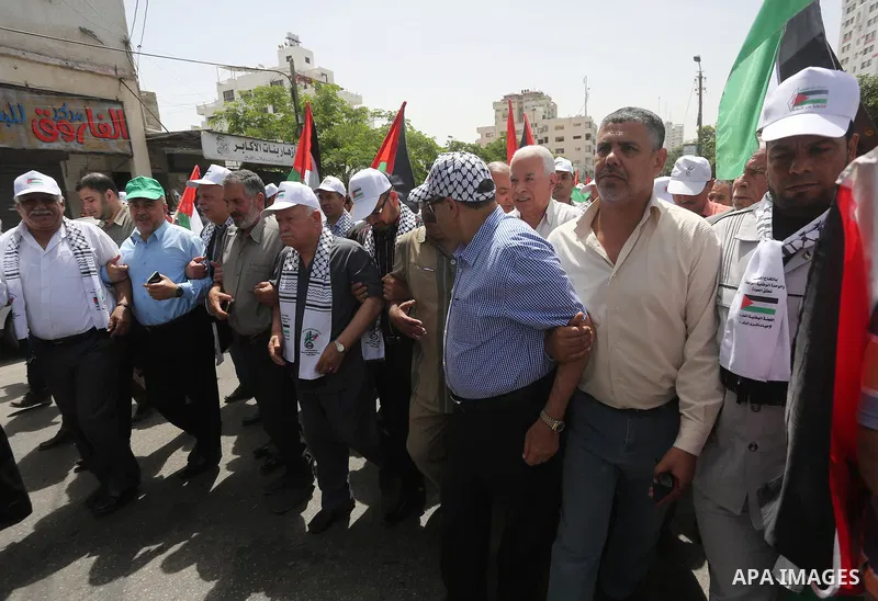 Palestinians wave national flags on May 15, 2016 in Gaza city during a rally to commemorate the "Nakba" or "catastrophe" in Arabic in reference to the establishment in 1948 of the state of Israel. "Nakba" means in Arabic...