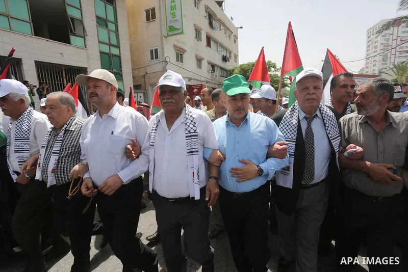 Palestinians wave national flags on May 15, 2016 in Gaza city during a rally to commemorate the "Nakba" or "catastrophe" in Arabic in reference to the establishment in 1948 of the state of Israel. "Nakba" means in Arabic...