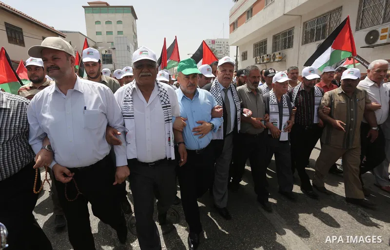 Palestinians wave national flags on May 15, 2016 in Gaza city during a rally to commemorate the "Nakba" or "catastrophe" in Arabic in reference to the establishment in 1948 of the state of Israel. "Nakba" means in Arabic...