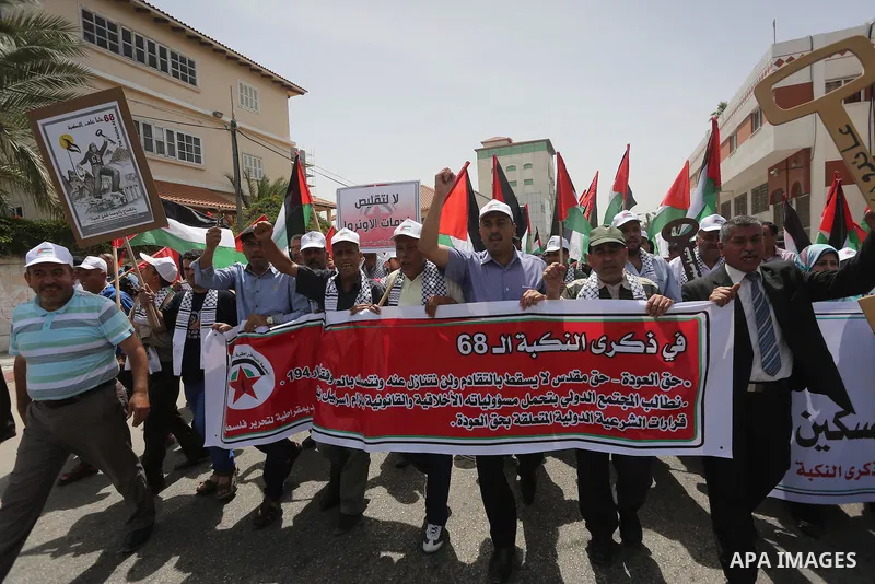 Palestinians wave national flags on May 15, 2016 in Gaza city during a rally to commemorate the "Nakba" or "catastrophe" in Arabic in reference to the establishment in 1948 of the state of Israel. "Nakba" means in Arabic...