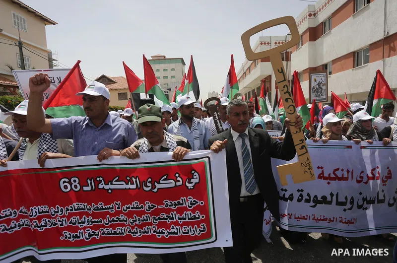 Palestinians wave national flags on May 15, 2016 in Gaza city during a rally to commemorate the "Nakba" or "catastrophe" in Arabic in reference to the establishment in 1948 of the state of Israel. "Nakba" means in Arabic...