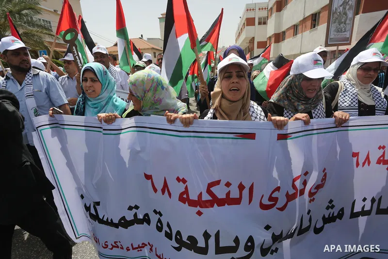 Palestinians wave national flags on May 15, 2016 in Gaza city during a rally to commemorate the "Nakba" or "catastrophe" in Arabic in reference to the establishment in 1948 of the state of Israel. "Nakba" means in Arabic...
