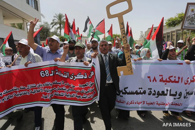 Palestinians wave national flags on May 15, 2016 in Gaza city during a rally to commemorate the "Nakba" or "catastrophe" in Arabic in reference to the establishment in 1948 of the state of Israel. "Nakba" means in Arabic...