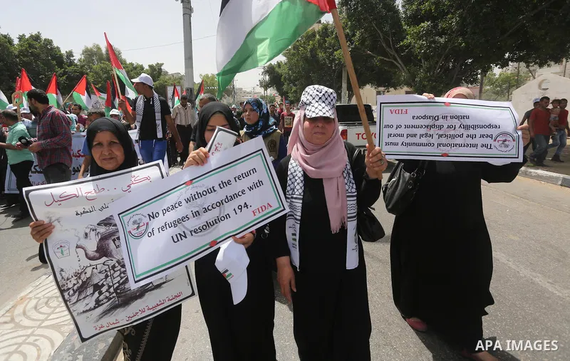 Palestinians wave national flags on May 15, 2016 in Gaza city during a rally to commemorate the "Nakba" or "catastrophe" in Arabic in reference to the establishment in 1948 of the state of Israel. "Nakba" means in Arabic...