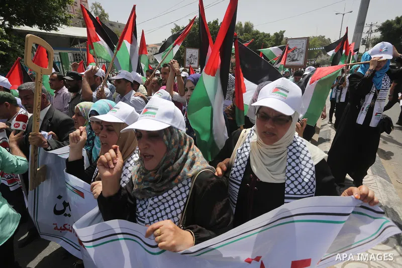 Palestinians wave national flags on May 15, 2016 in Gaza city during a rally to commemorate the "Nakba" or "catastrophe" in Arabic in reference to the establishment in 1948 of the state of Israel. "Nakba" means in Arabic...